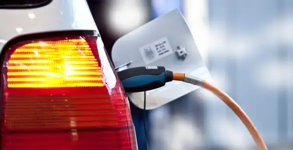 Electric car plugged into EV charger after professional installation in Dayton, OH