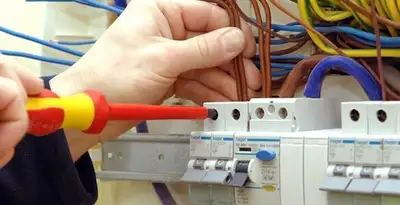electrician services performing professional electrical panel wiring and connections in Dayton, OH