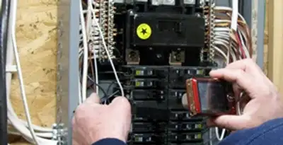 Home electrical inspection of circuit breaker panel by licensed electrician in Dayton, OH