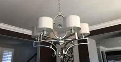 Modern chandelier installation with multiple light fixtures in Dayton, OH