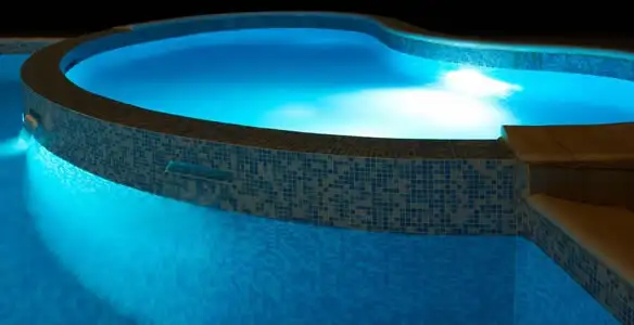pool light installation and repair services highlighting illuminated pool interior lighting in Dayton, OH