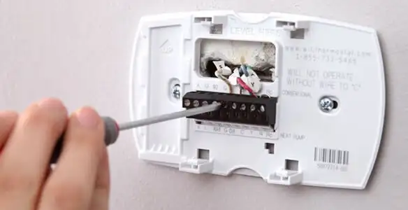 Thermostat installation service with proper wiring and secure wall mounting in Dayton, OH