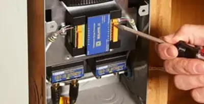 Whole home surge protection device being installed by a licensed electrician to protect electrical systems in Dayton, OH